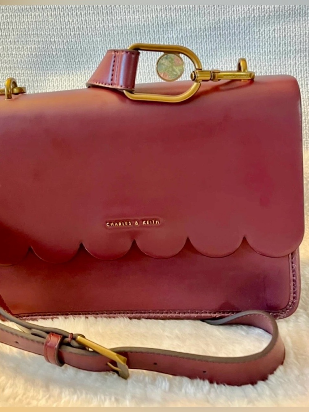 Charles & Keith Burgundy Scalloped Crossbody Bag with Gold Hardware